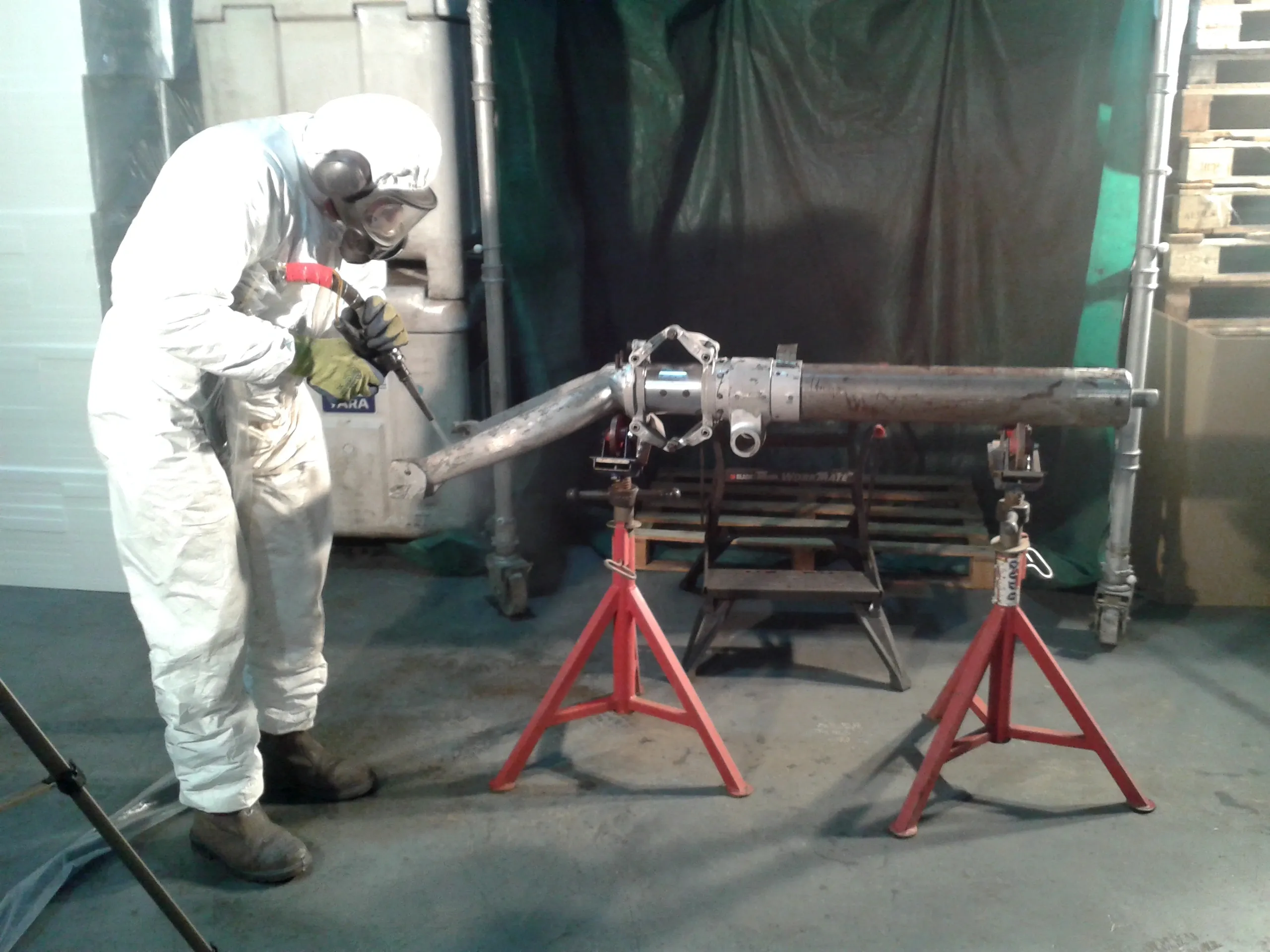 Dry Ice blasting operative cleaning a small piece of machinery