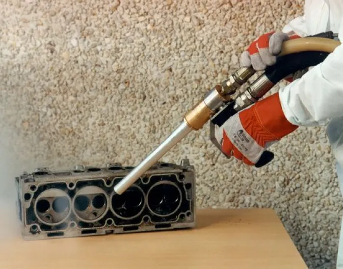 Dry Ice Blasting shown cleaning delicate automotive parts